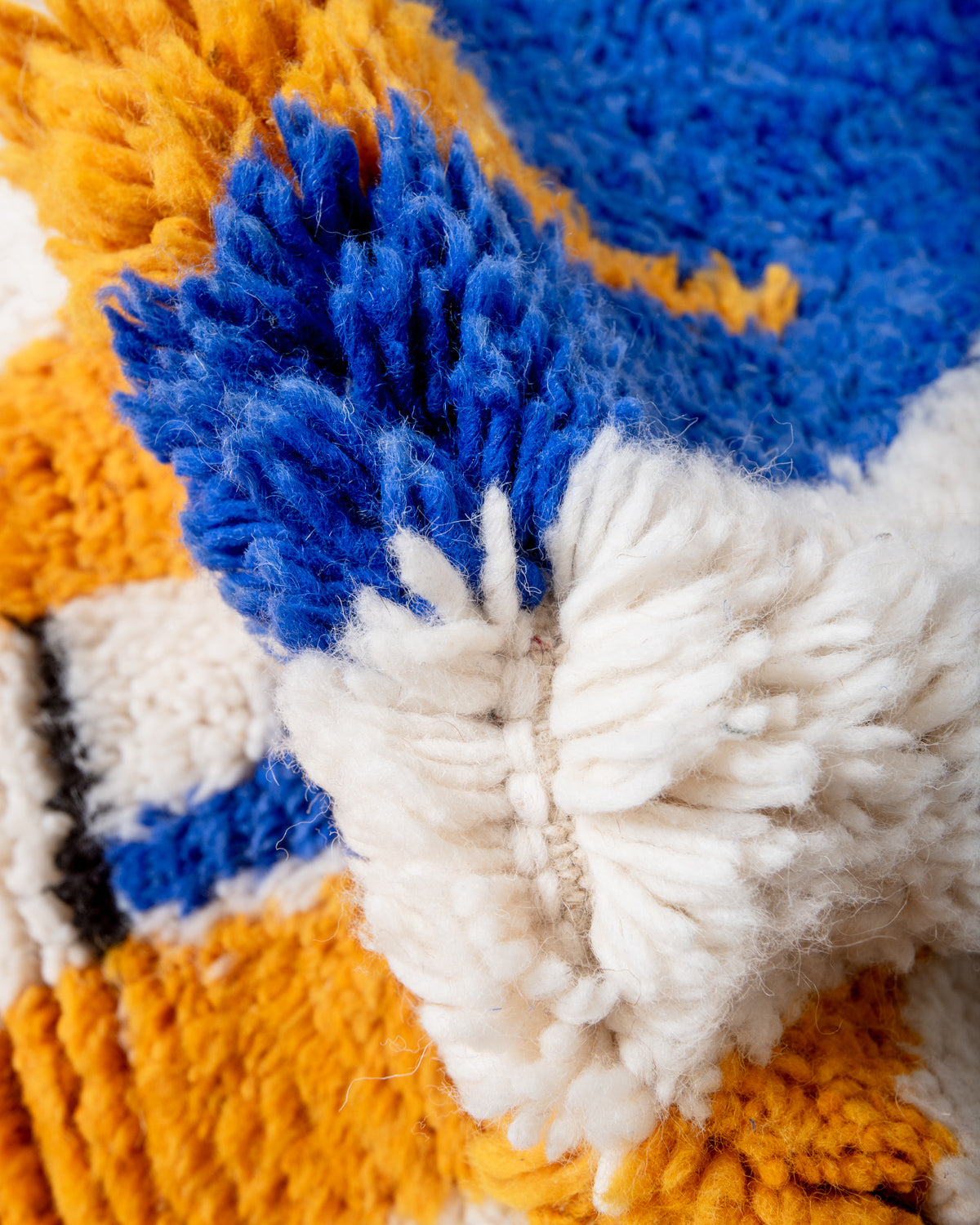 Modern, designer, handcrafted Berber rug from Morocco. Beniourain carpet with beautiful colours and patterns and fluffy wool texture.
